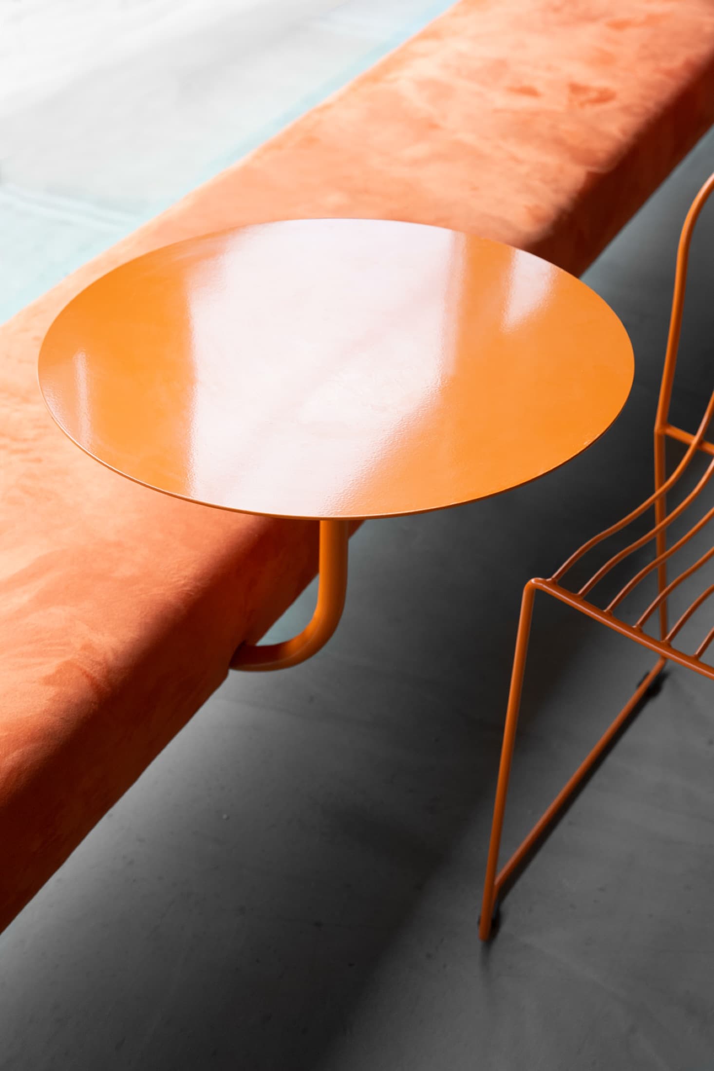 Orange round table and chairs in the brasserie